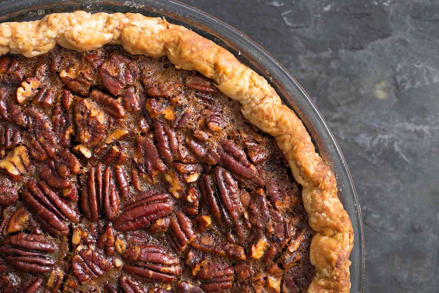 Close up of baked pecan pie filling.