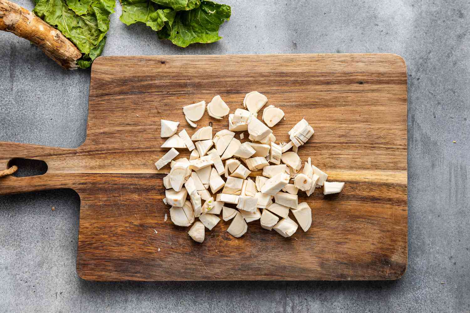 Fresh Horseradish root on a cutting board, Cut into Pieces