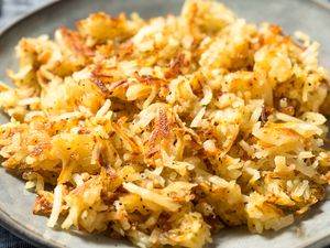 A plate of cooked hash browns