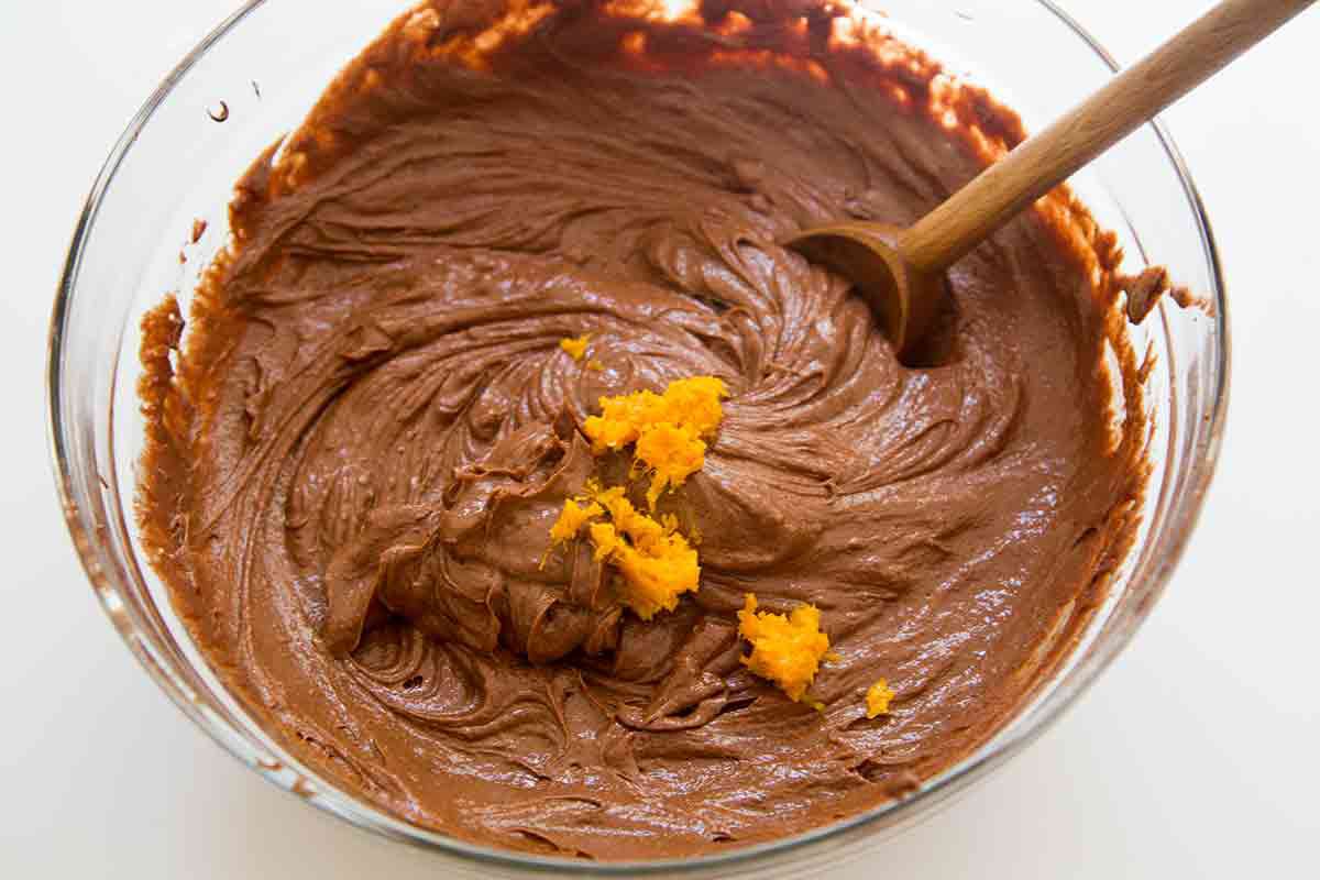 mixing orange zest into bittersweet chocolate cake batter