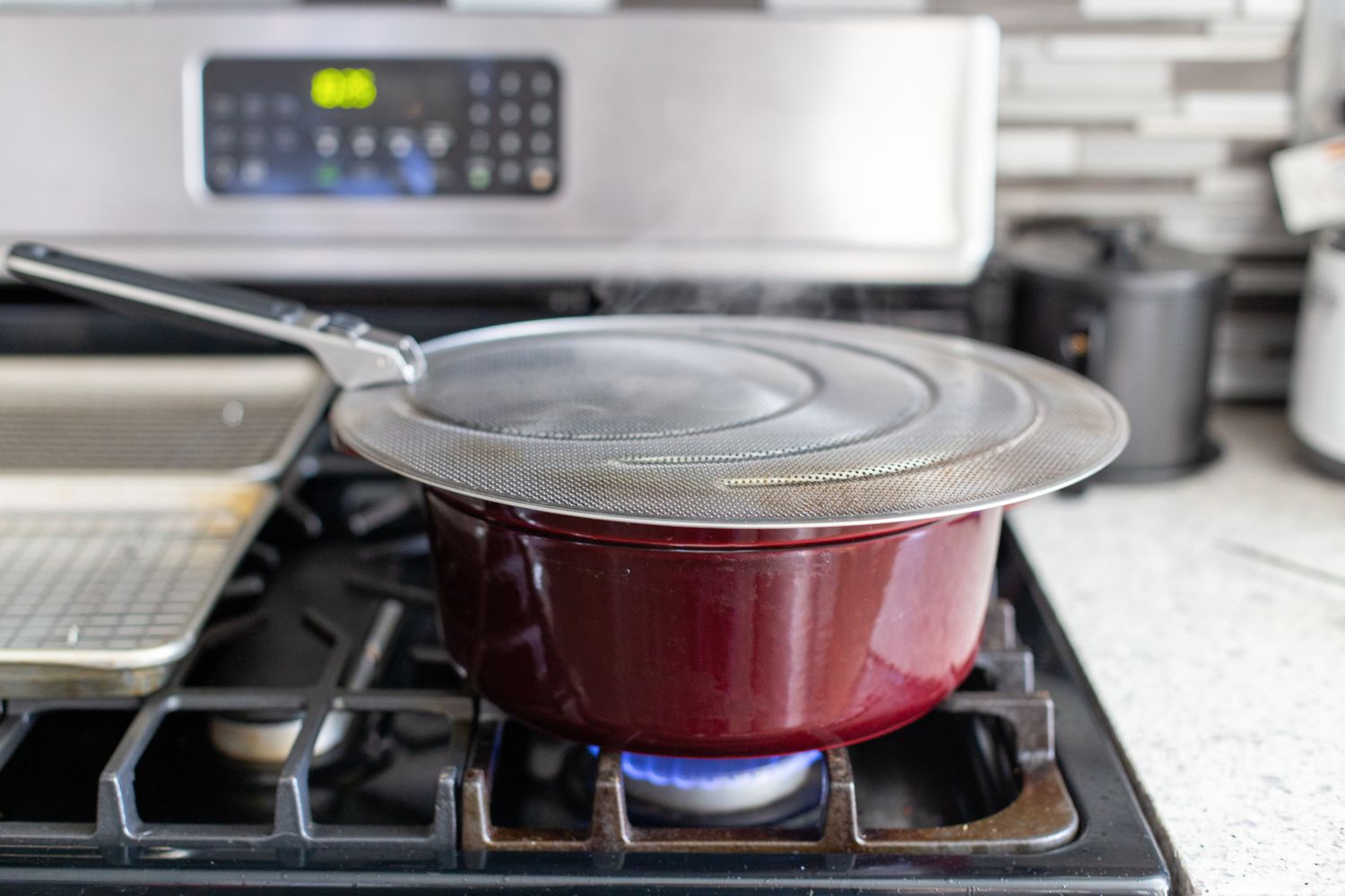 Dutch Oven Covered with a Splatter Screen for Deep Fried Brussel Sprouts