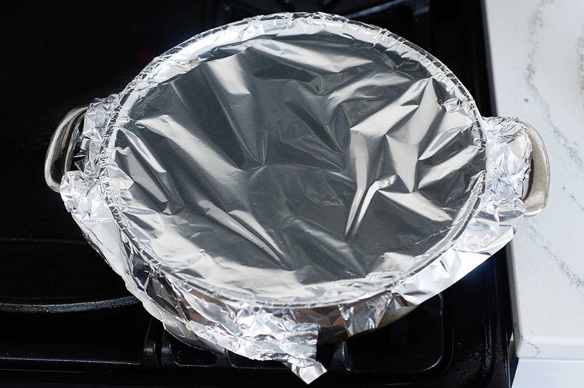 Foil covered pot to make beef short ribs.