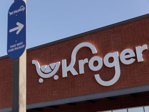Kroger storefront with a pickup sign visible in the foreground
