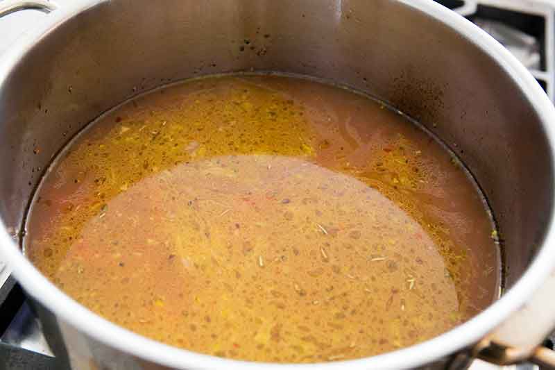 Adding stock to veggies for pasta fagioli