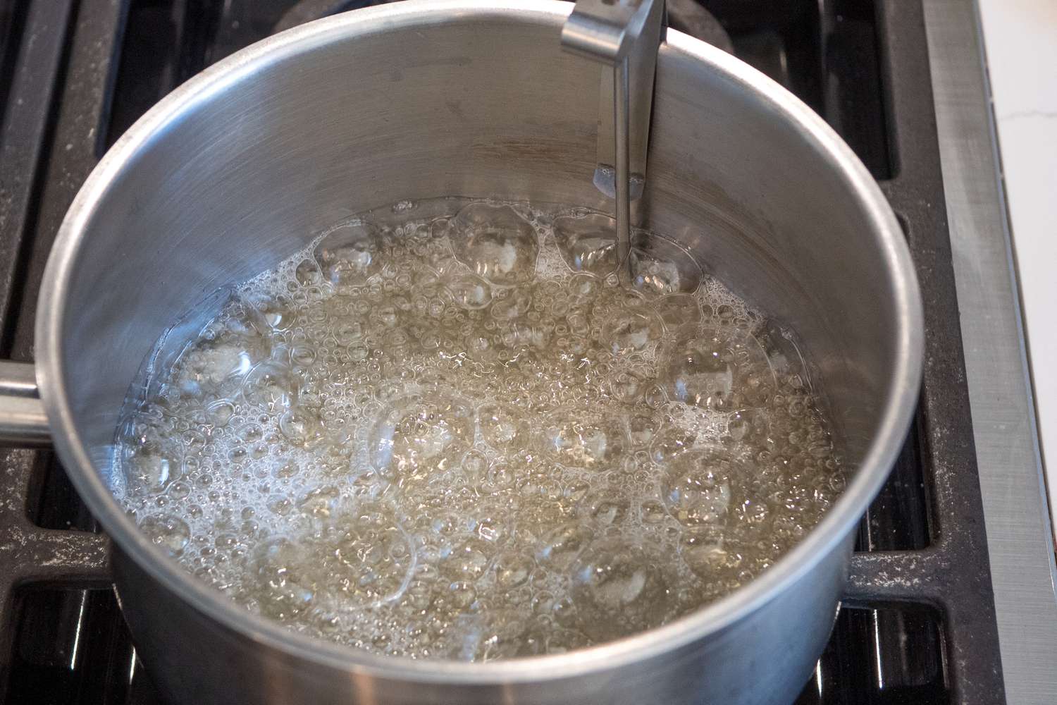 Pot of Sugar and Corn Syrup Boiling on a Stove for Marshmallows Vegan Recipe