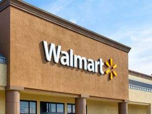 Facade of a Walmart store with the company logo displayed prominently on the building