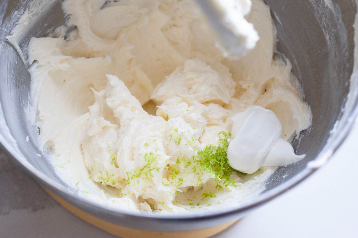 Add key lime zest to cream cheese mixture.