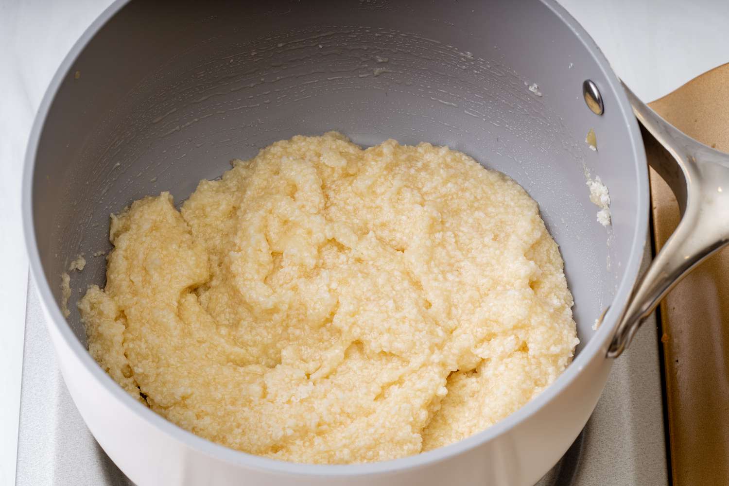 The mixture for Coconut Macaroons in a saucepan