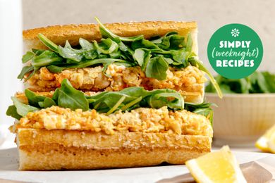 A closeup of a sandwich with lettuce and filling part of a Simply Recipes promotion
