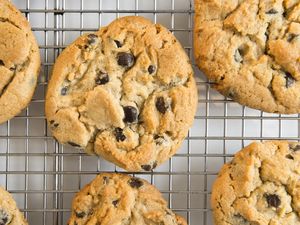 Chocolate chip cookies cooling on a wire rack