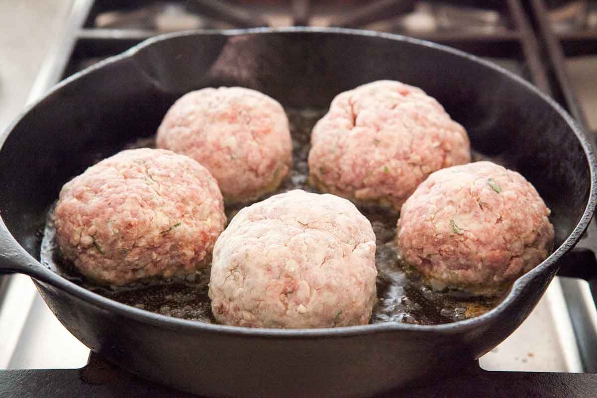 Brown both sides of the meatballs in a skillet