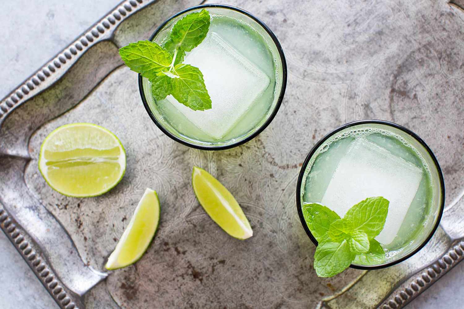 Easy Limeade in two glasses with mint sprigs