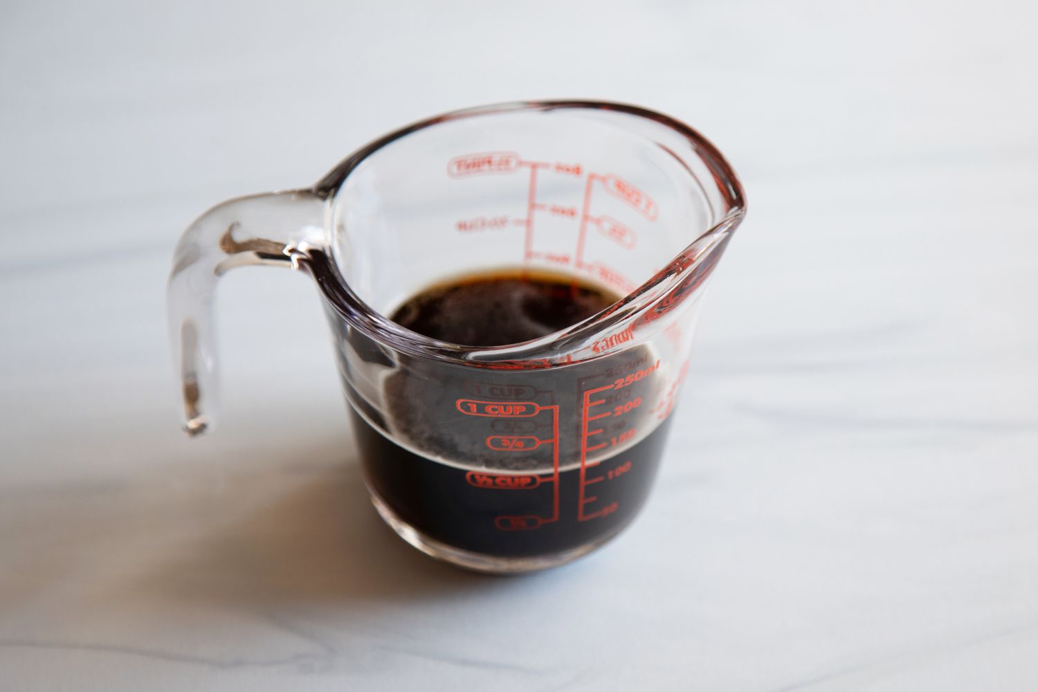 A measuring cup with porter in it to make a Virginia Peanut Pie with Porter.