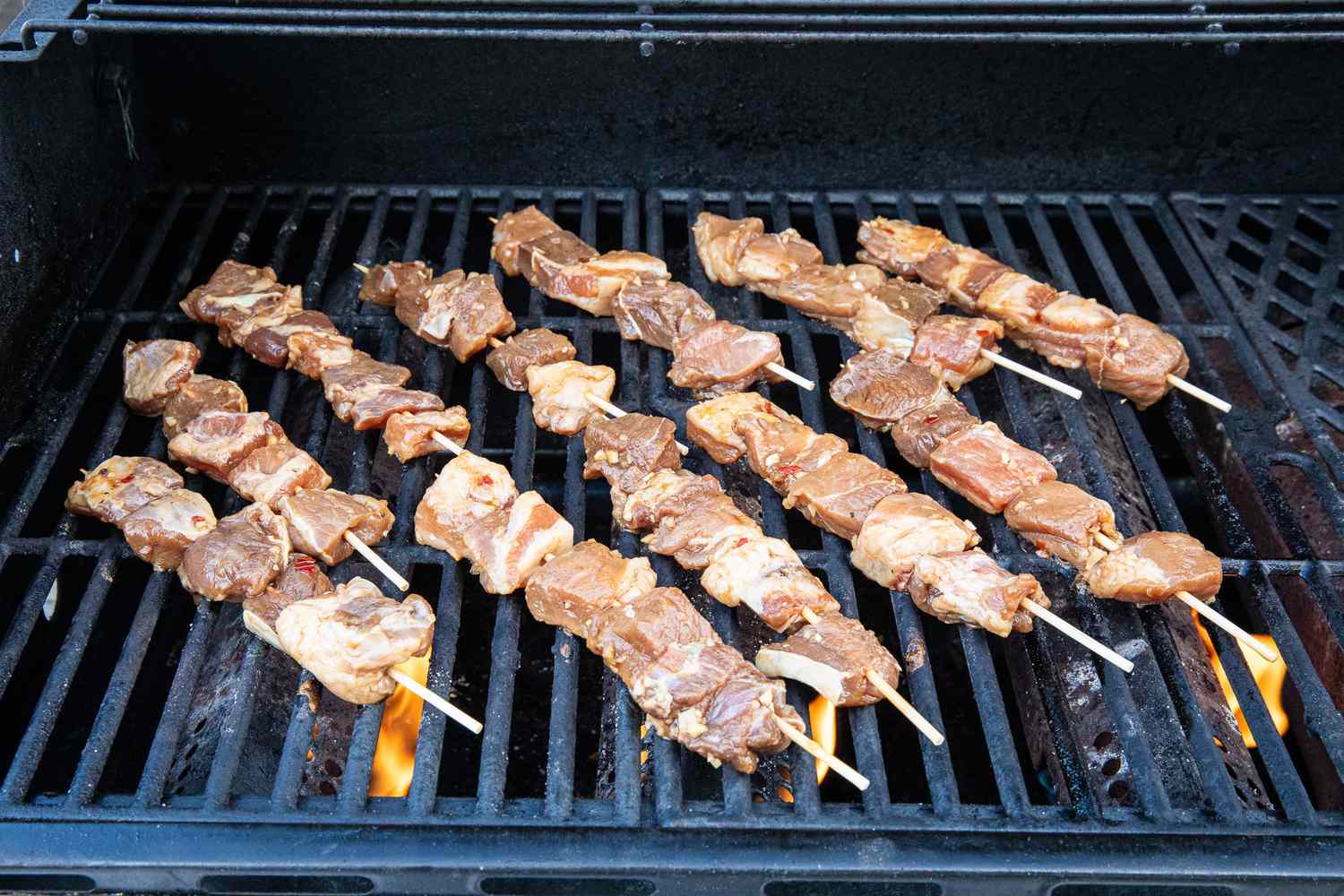 pork skewers on a grill