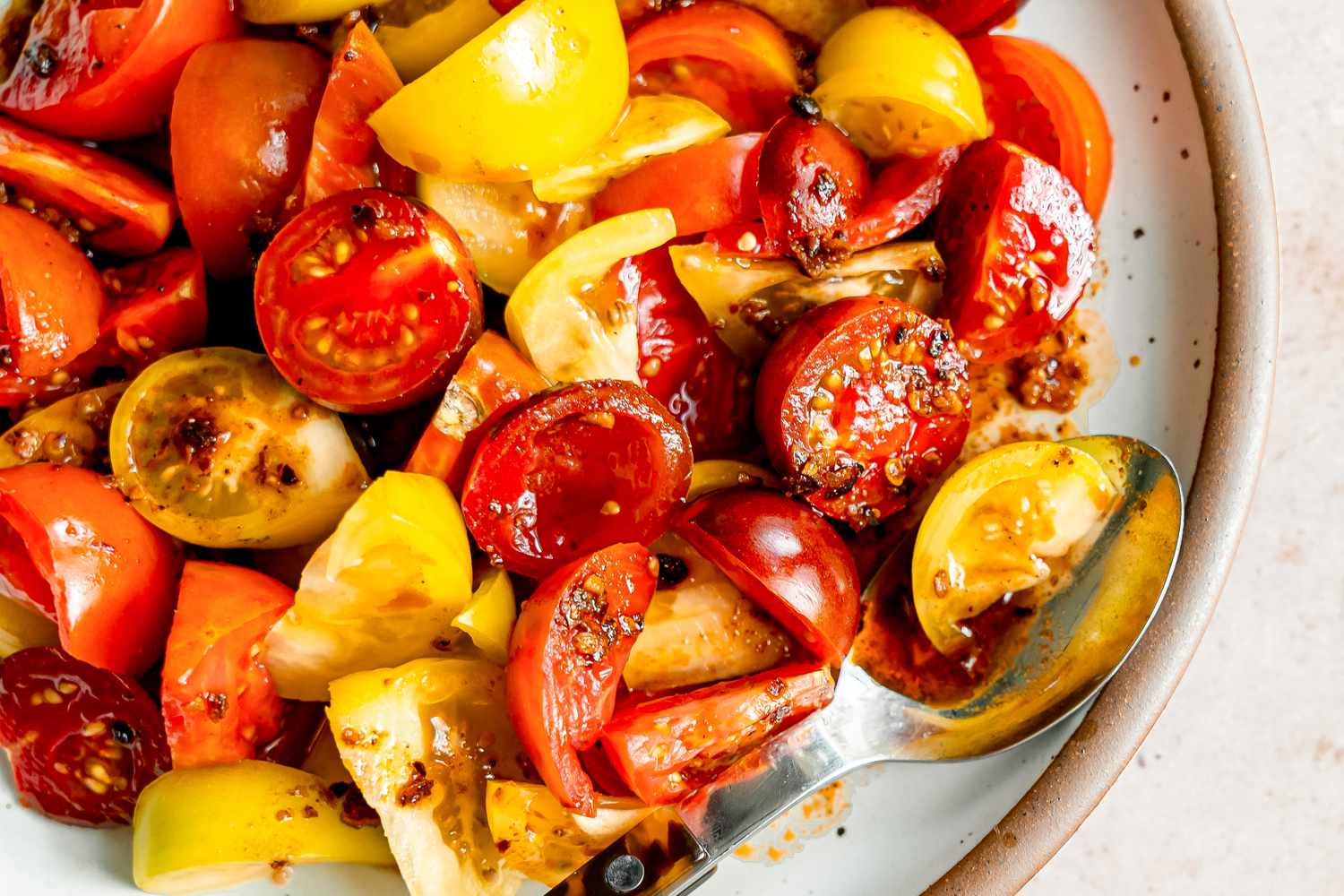 5-ingredient chili crisp tomato salad on a plate (close-up)