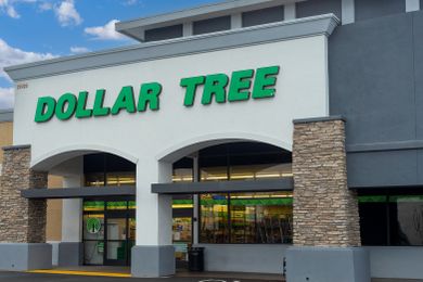 Exterior view of a Dollar Tree store with its logo displayed on the facade