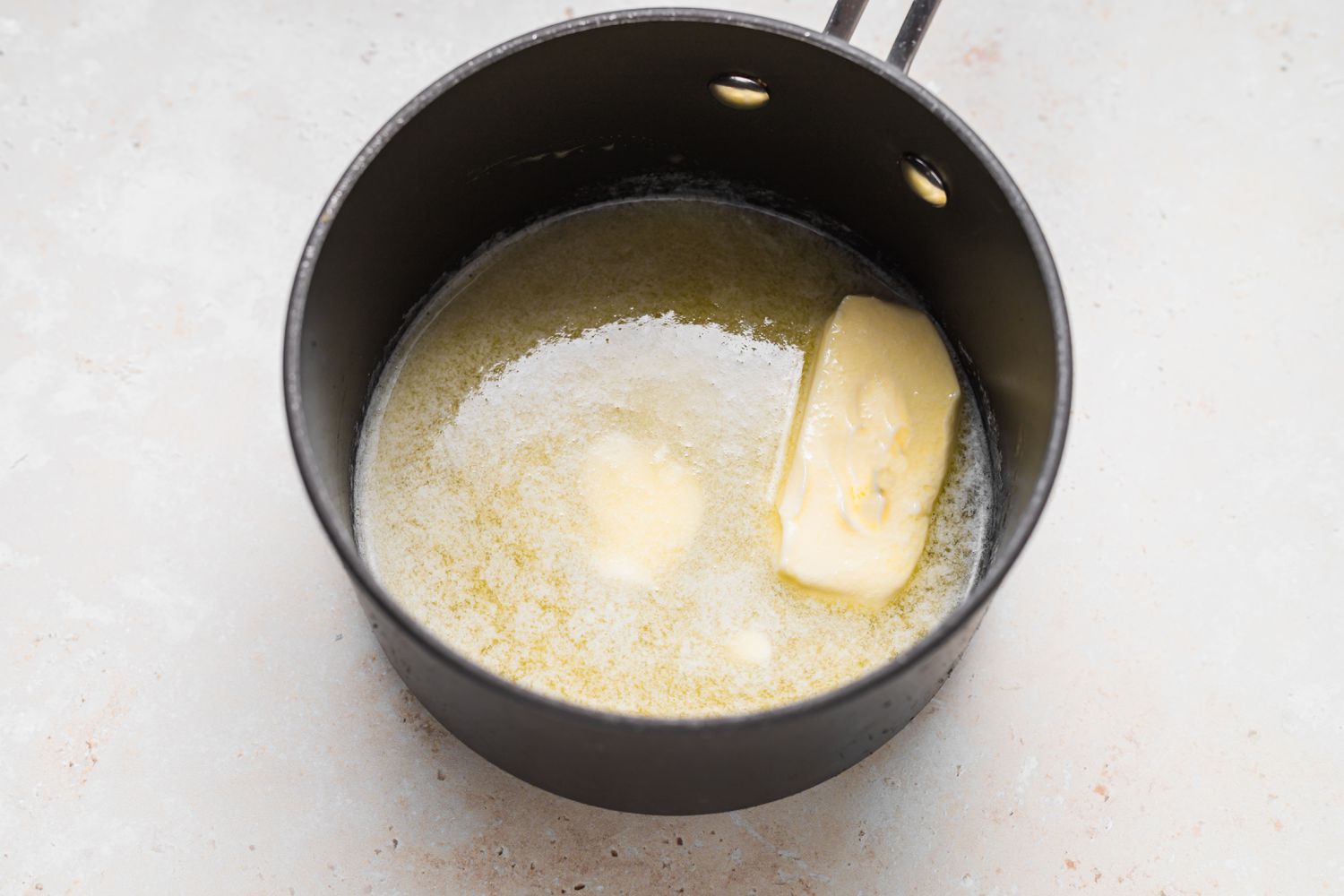 Butter melting in a pot to make Blender Hollandaise