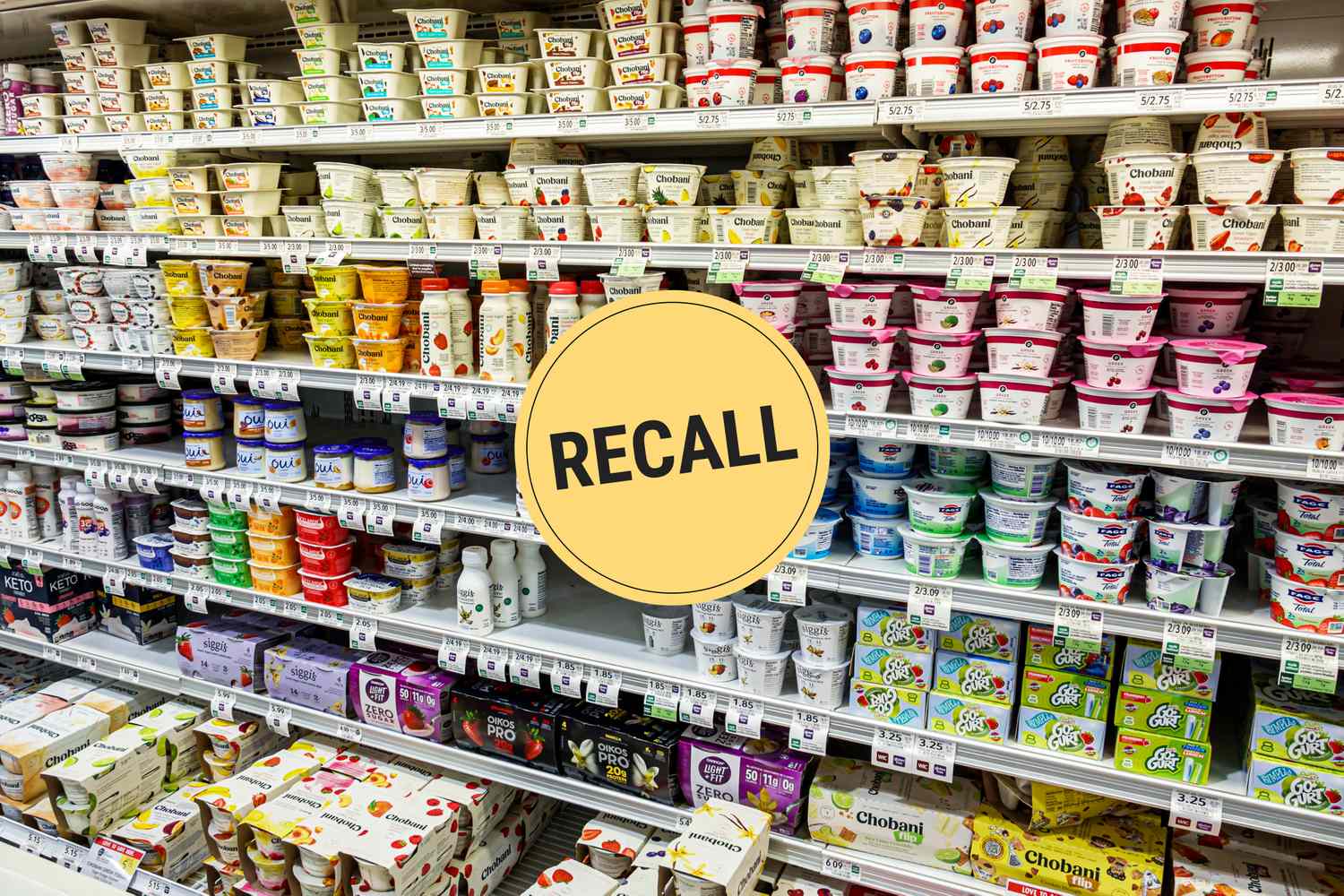 A supermarket aisle displaying yogurt products with a circular yellow recall notice graphic overlayed