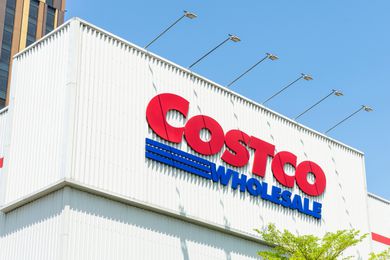 Costco storefront and sign with blue sky above