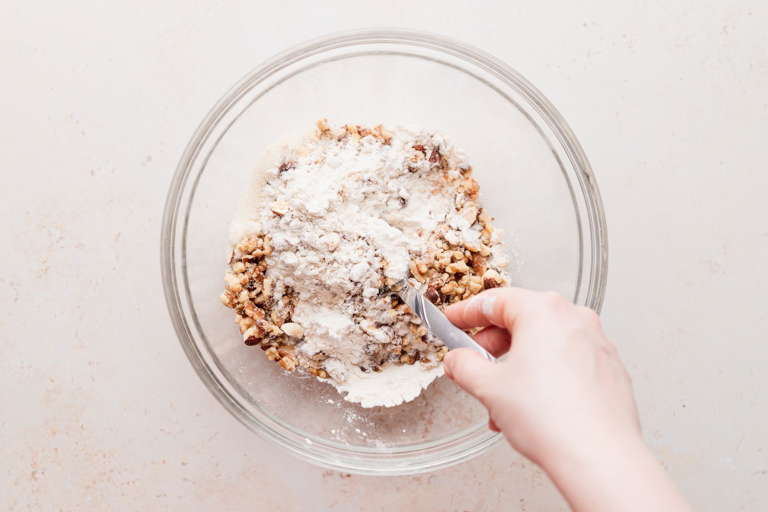Making the dough for a snowball cookie recipe.