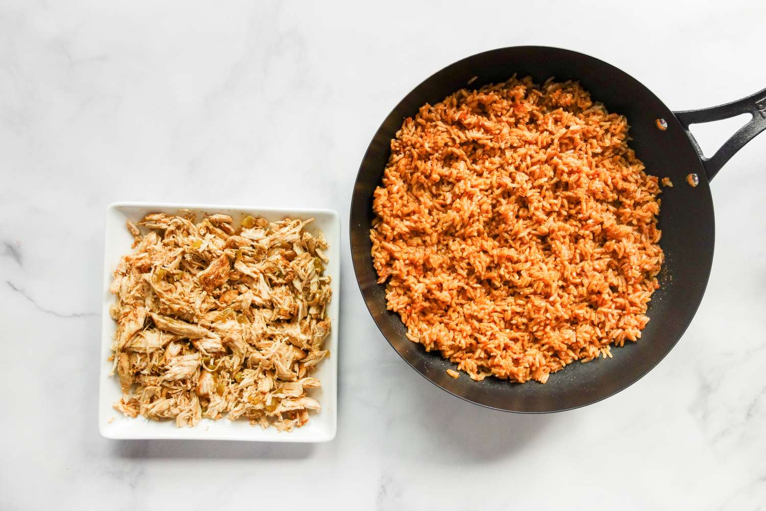 Shredded chicken and pot of rice.