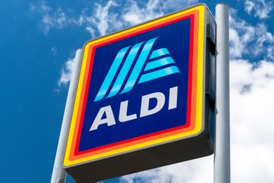 Aldi store sign against a cloudy sky