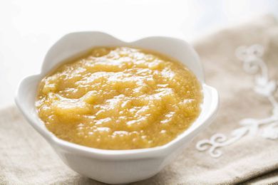 A bowl of homemade Applesauce in a white bowl