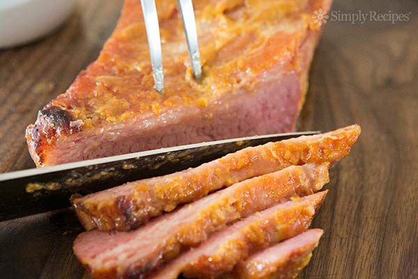 Slicing baked corn beef across the grain for corned beef and cabbage