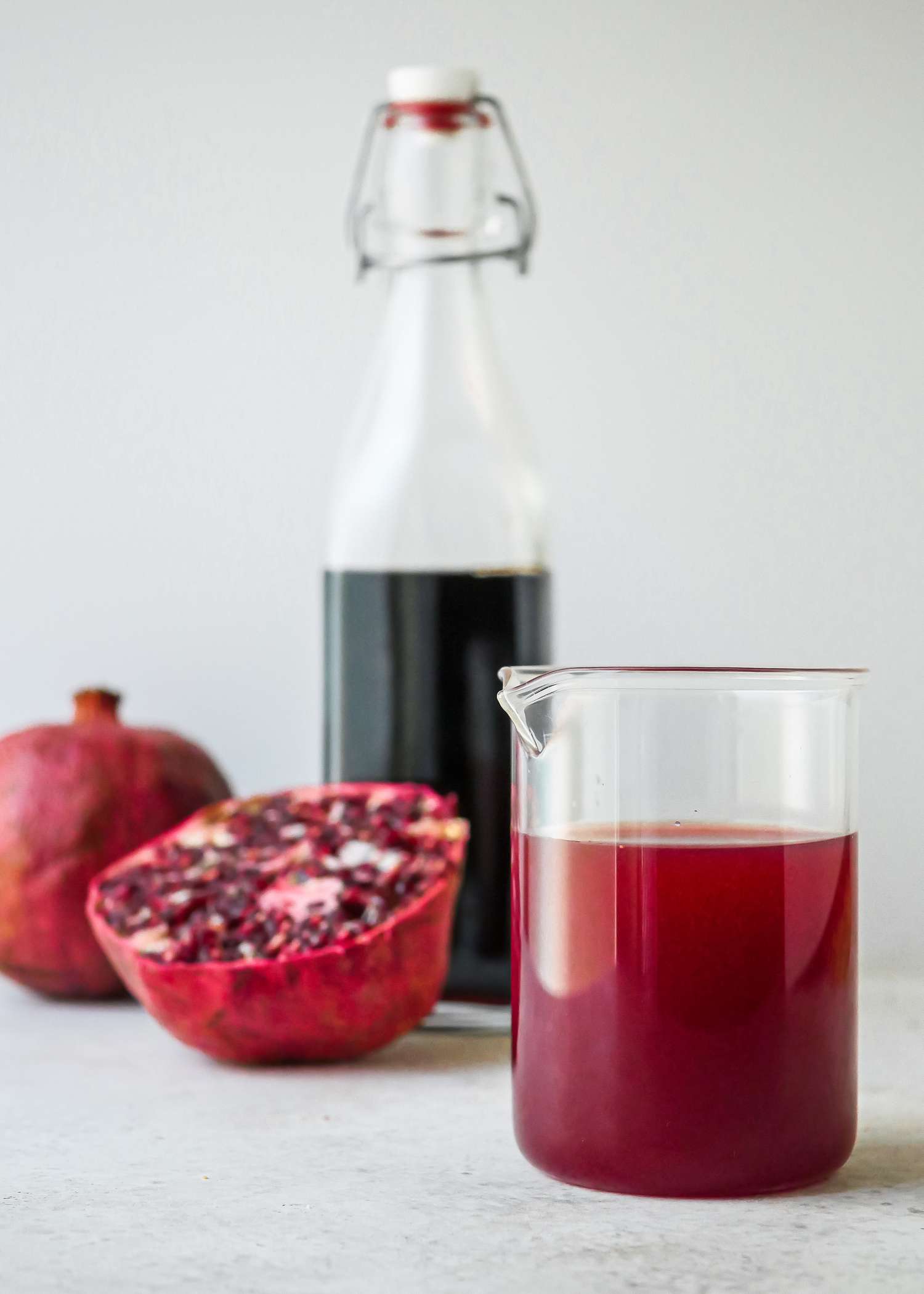 Grenadine, Non-alcoholic Bar Syrup in a cocktail mixing glass.