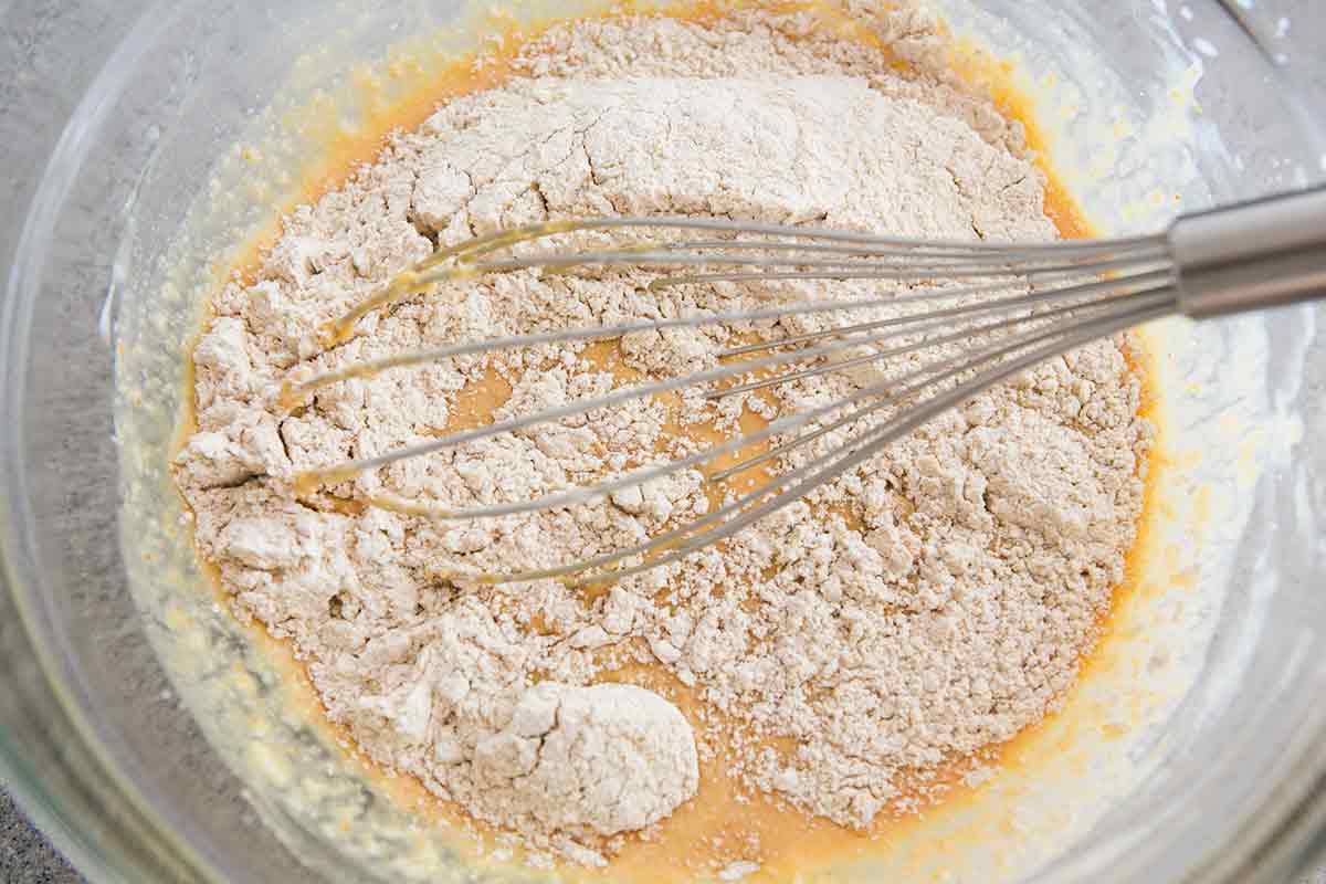 whisking all ingredients for pumpkin waffles