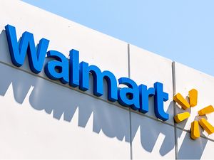 Walmart sign on a building featuring the logo and name