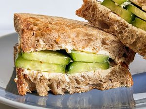 cucumber and cream cheese sandwich on a plate