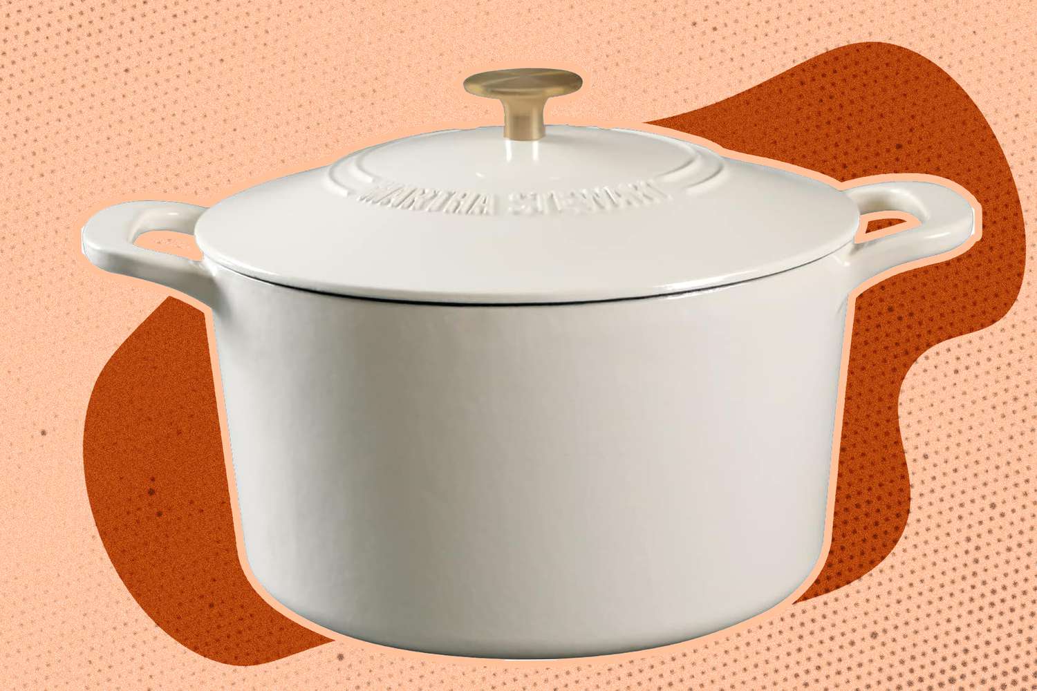 A white Dutch oven with a gold handle