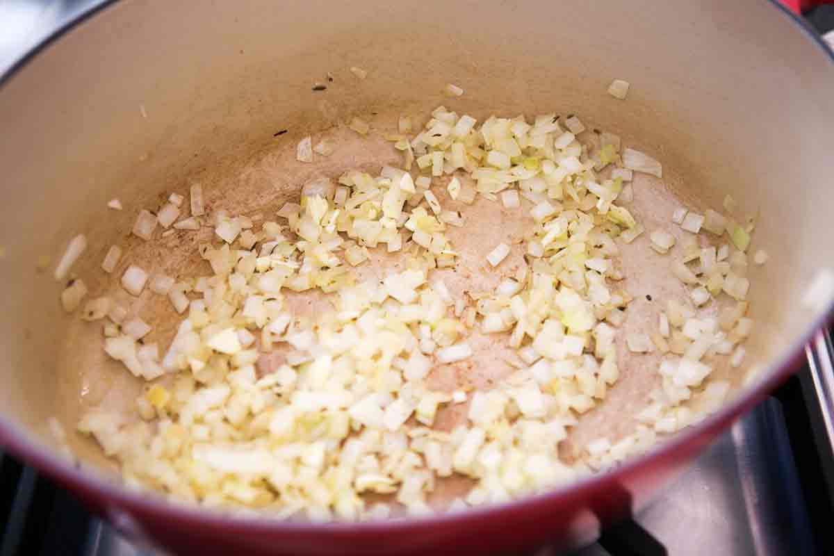 saute onions cumin garlic as base for refried black beans