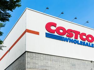 Costco Wholesale storefront with visible logo and building structure in daytime