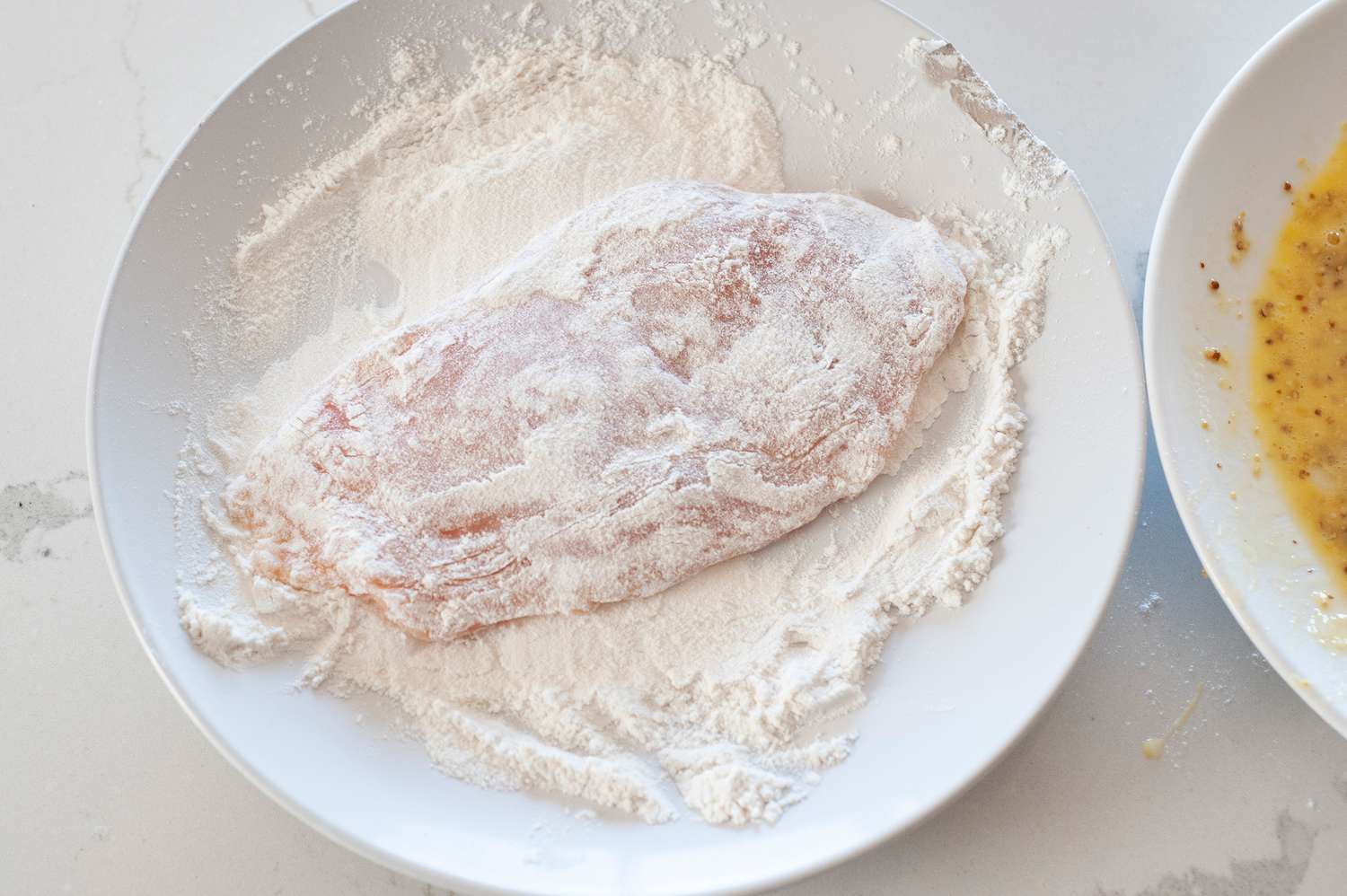 dredge chicken cutlets in flour