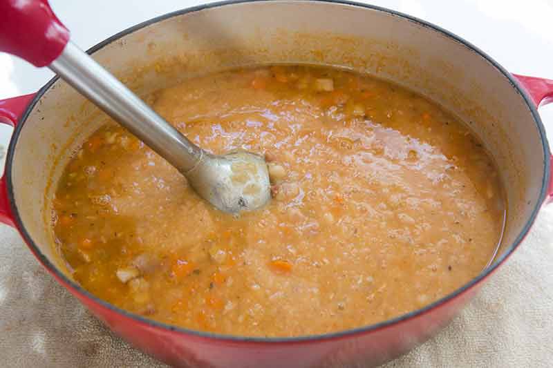 puree bean soup with stick blender