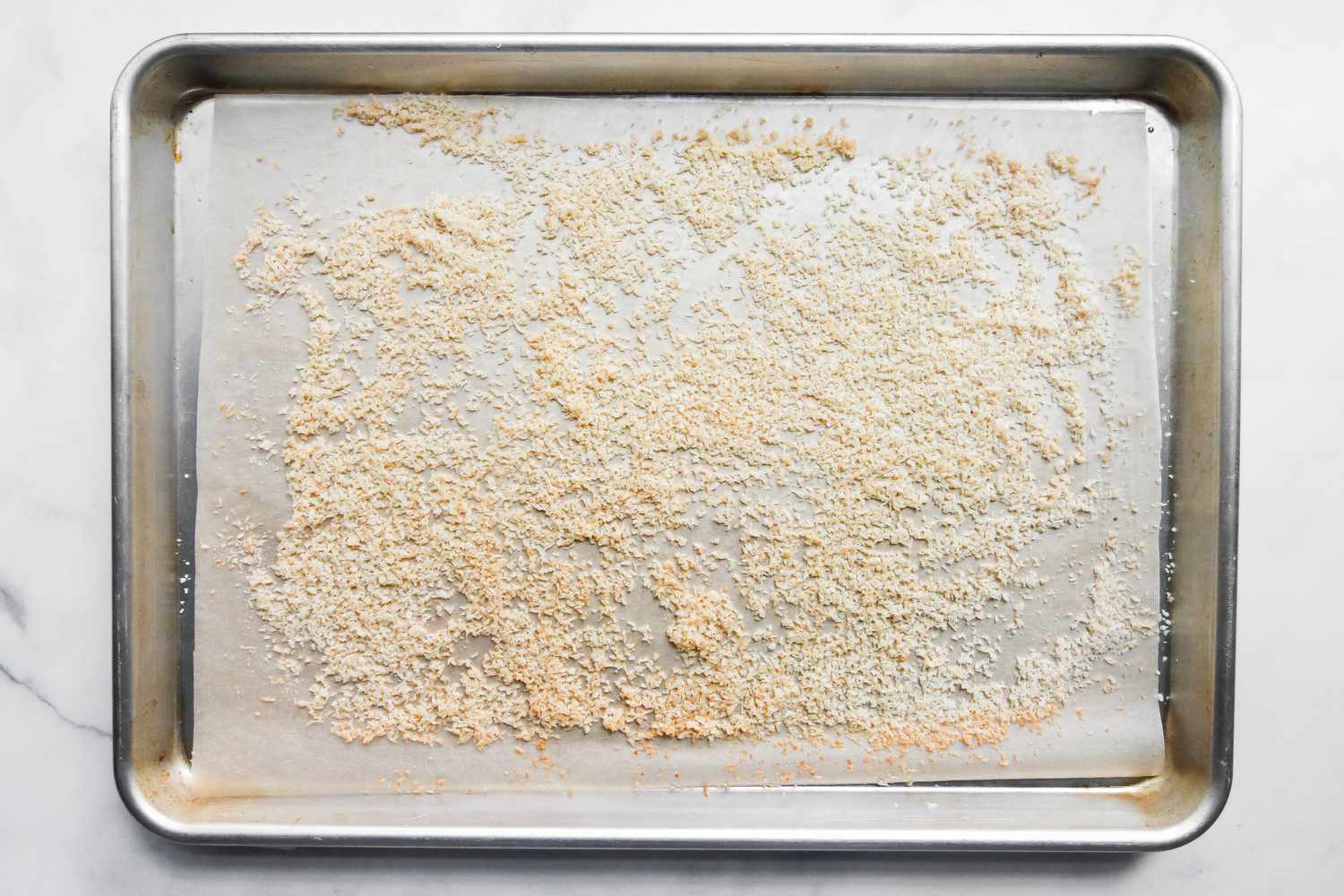 toasted coconut on sheet pan