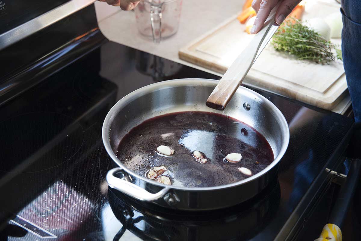 Red wine and garlic in a sauce pan to deglaze the bottom from searing a roast.