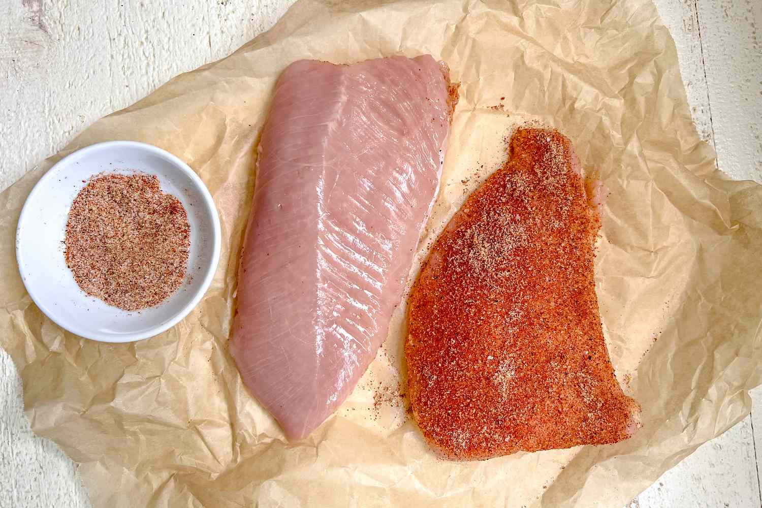 Turkey Tenderloin Seasoned with Spices on Parchment Paper