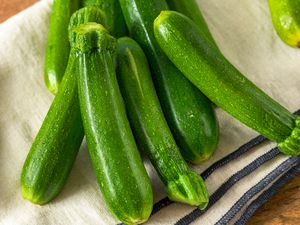raw zucchini on a kitchen towel