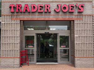 Entrance to a Trader Joes store with shopping carts nearby