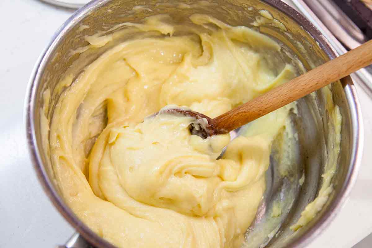 stir cheese puff gougere dough until creamy