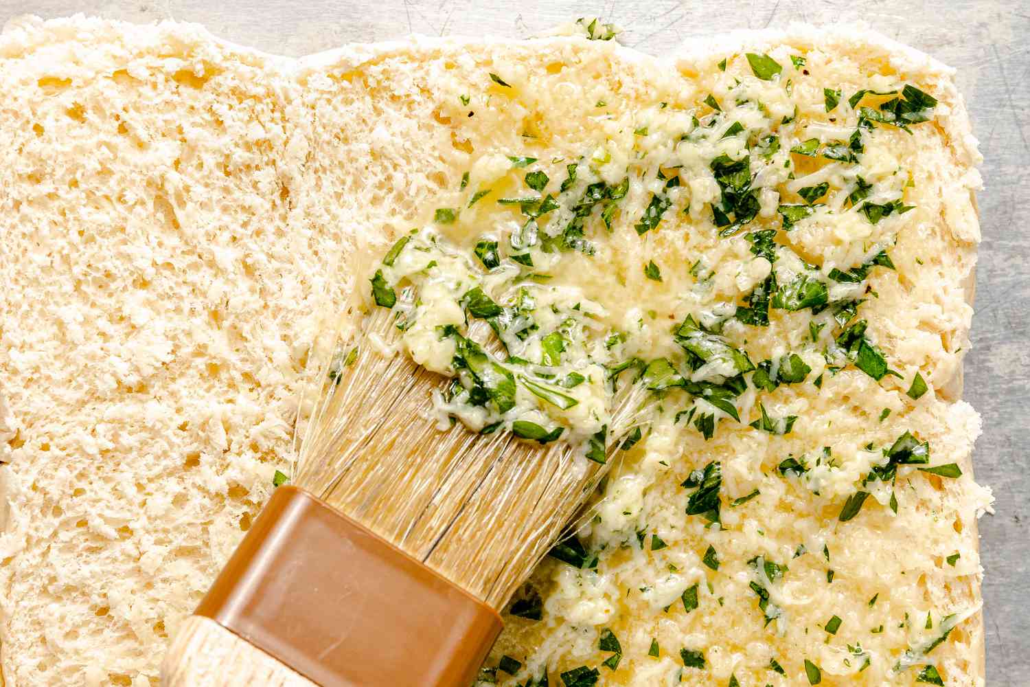 Garlic butter brushed on store-bought dinner rolls