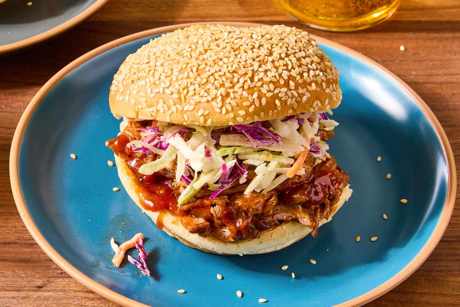 Texas-Style Pulled Pork sandwich with slaw on a sesame seed bun