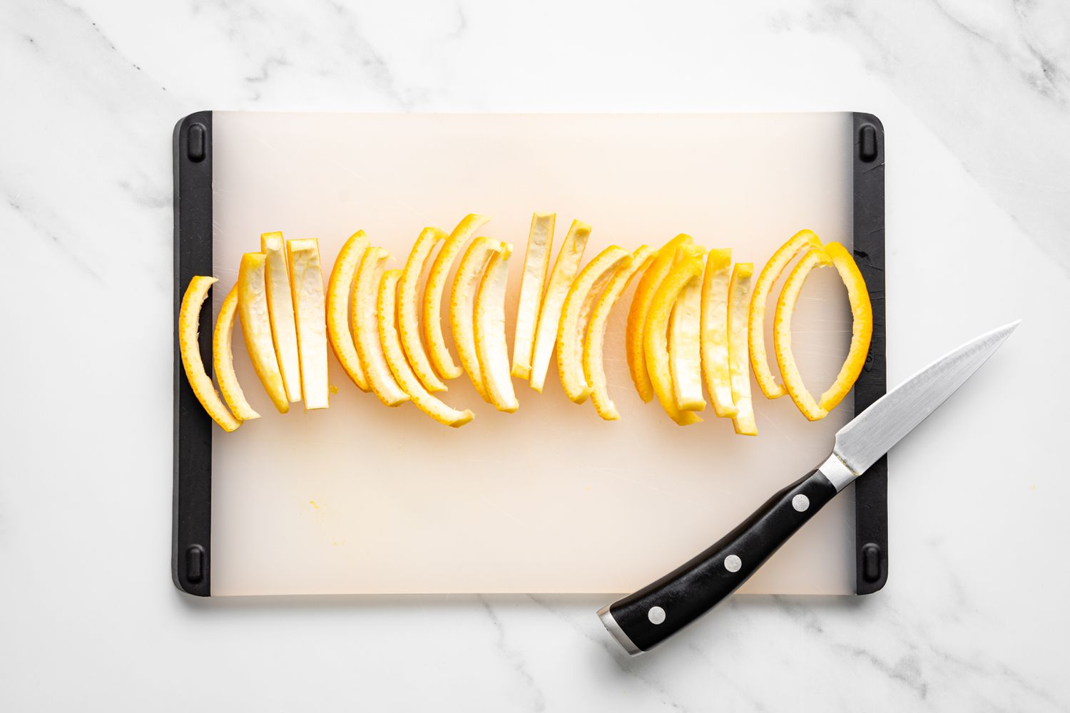Orange Peels Cut into Slices on a Cutting Board for Chocolate Orange Peels Recipe