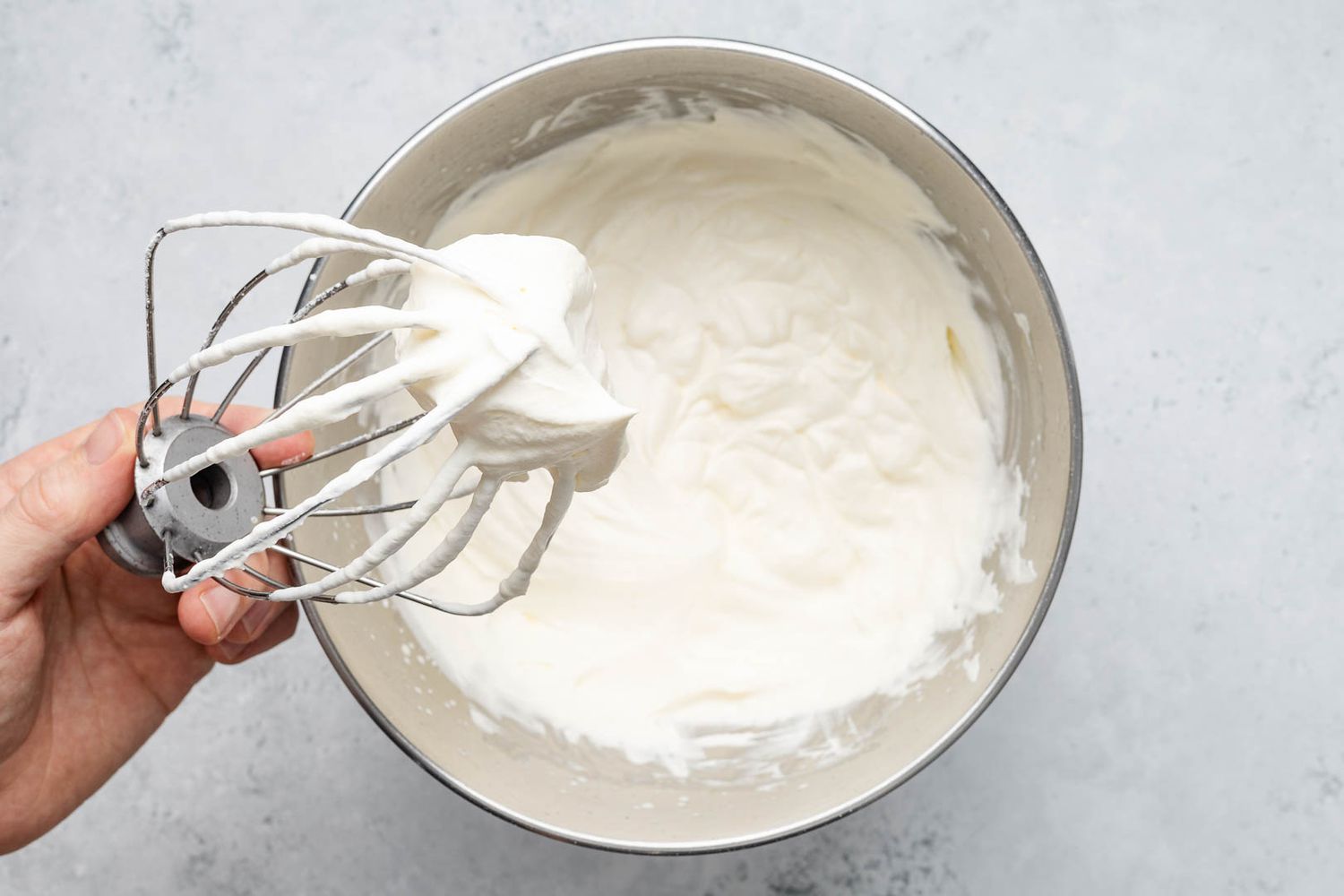 Stand mixer whisk attachment with stiff peaked whipping cream for ritz torte recipe
