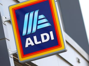 Aldi logo on a building wall
