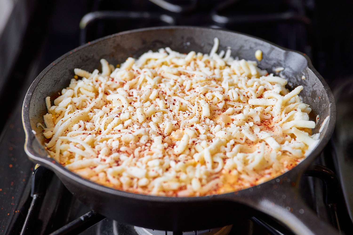 Cheese Corn in Cast Iron Skillet Topped With More Cheese for Korean Barbeque Cheese Corn Recipe
