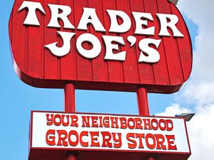 Trader Joe's store sign, text displaying branding and slogan